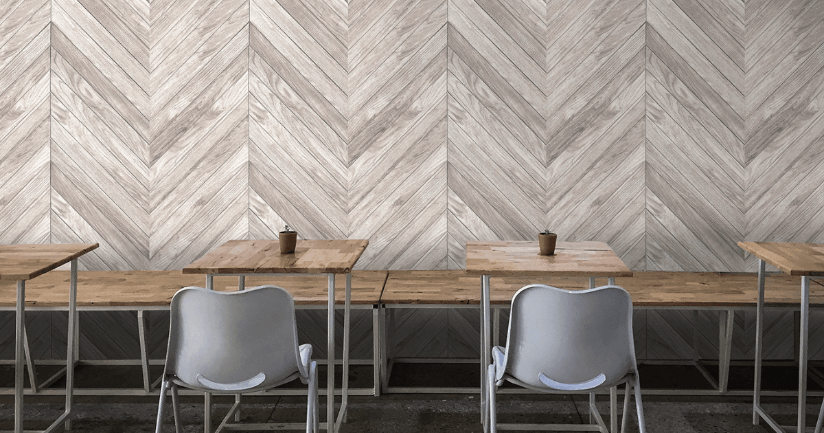 Modern office interior featuring a custom QuietPrint feature wall combining digital artwork with noise-absorbing acoustic panels