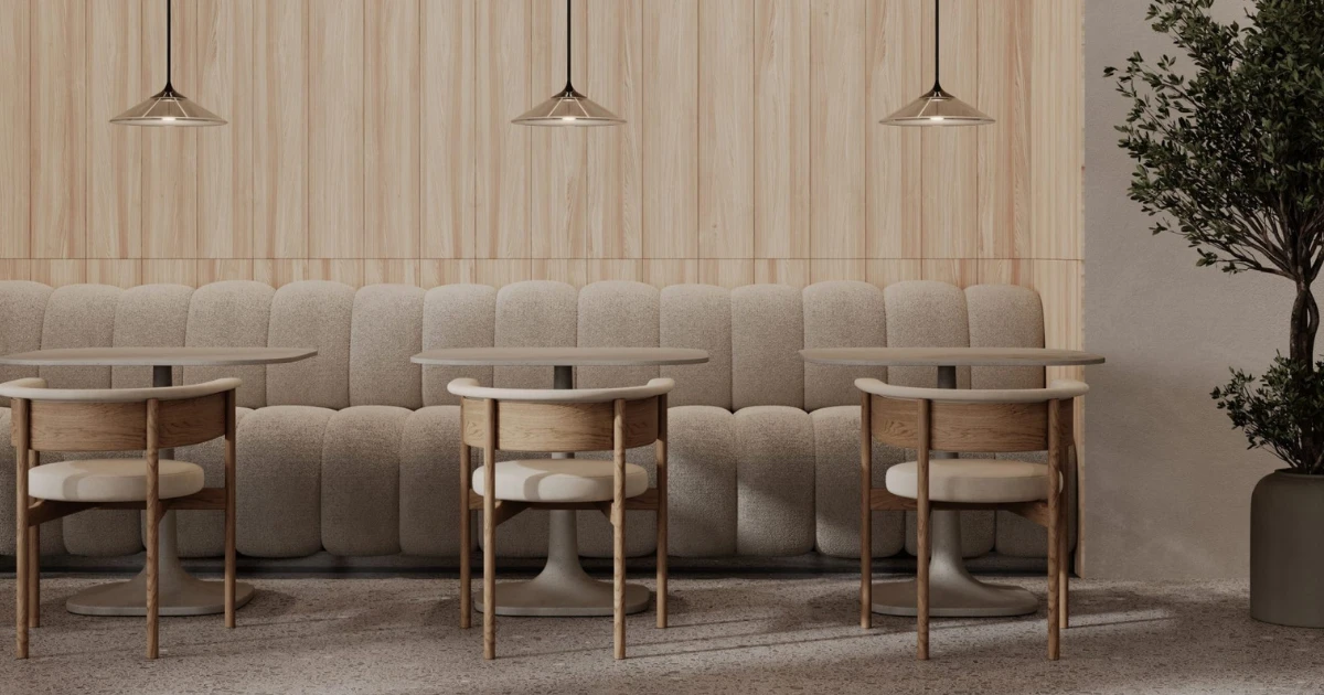 Modern café interior featuring a light timber feature wall clad in Acoufelt WoodBeQuiet Lyed Larch acoustic plank wall tiles