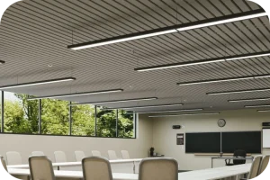Modern conference room featuring suspended Acoufelt Rafter Ceiling Frames in Platinum gray for linear structural interest and targeted noise control